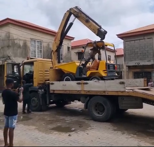 1.5ton dumper offloaded from trailer in Tanzania